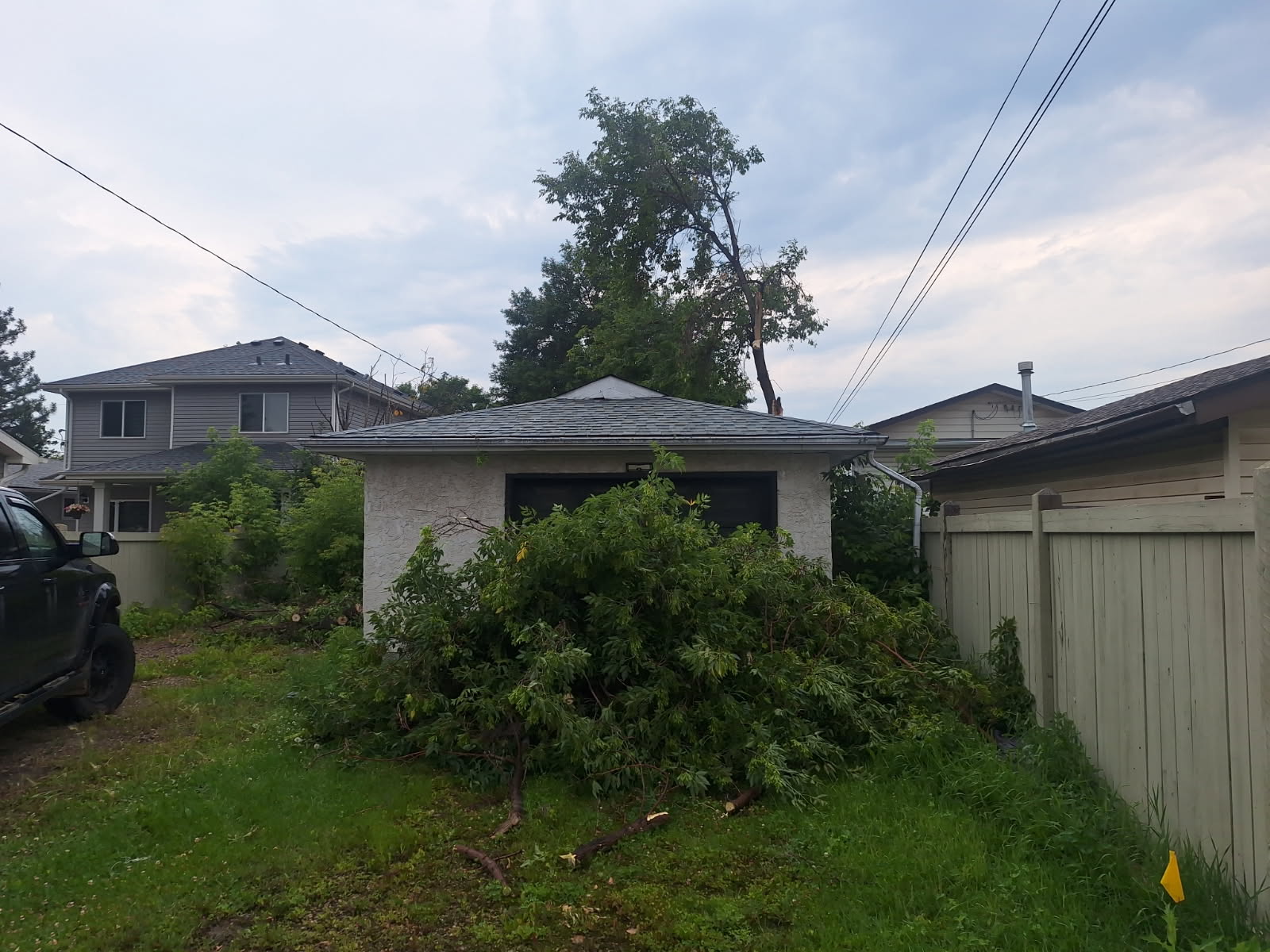 Garage cleared after emergency tree removal by Miles Of Construction
